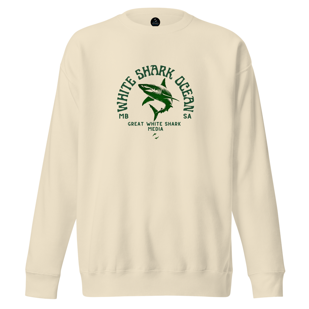 Beige sweatshirt with green shark graphic and text on a white background | white shark ocean media