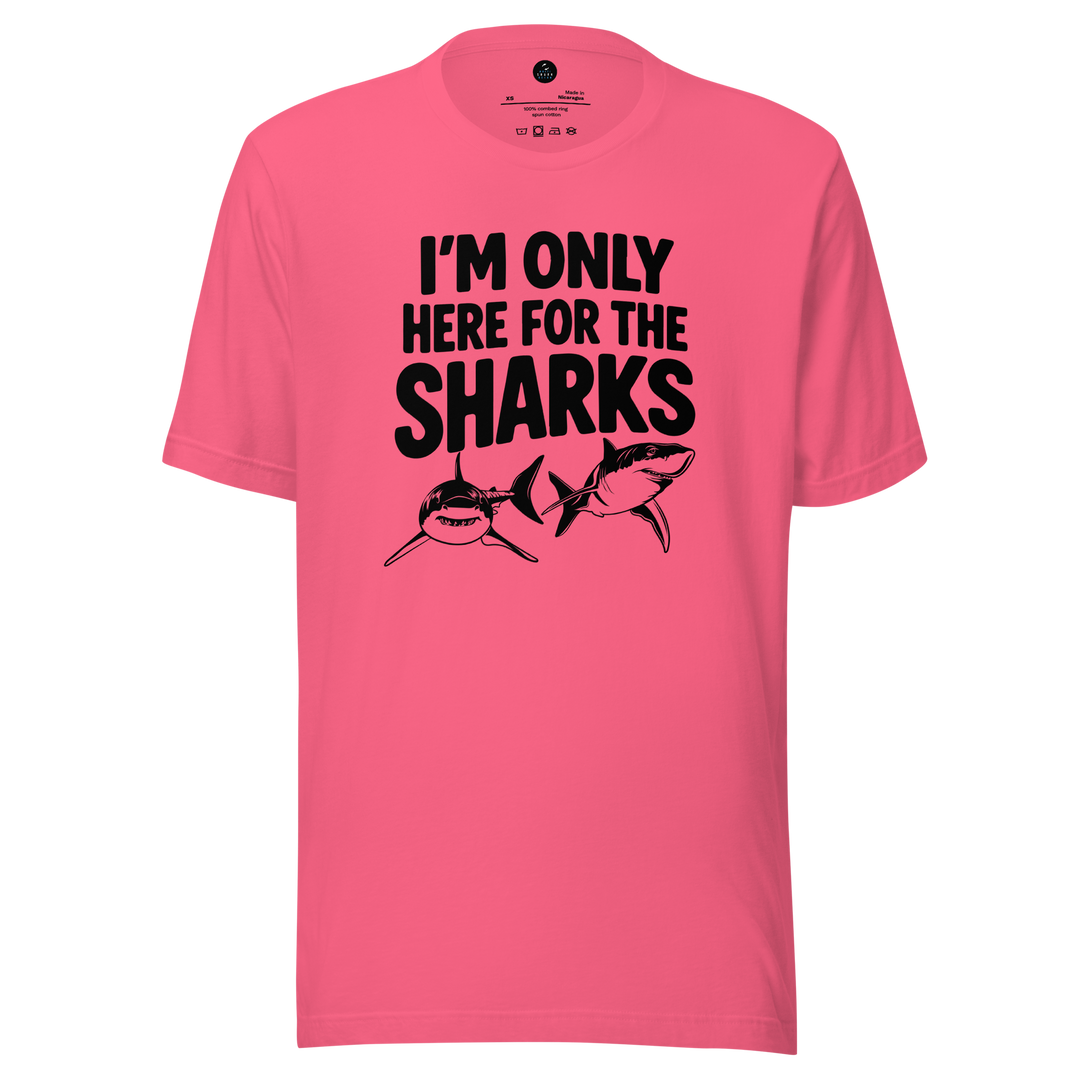Pink t-shirt with black text and shark graphics on a white background
