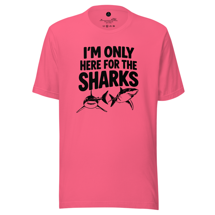 Pink t-shirt with black text and shark graphics on a white background