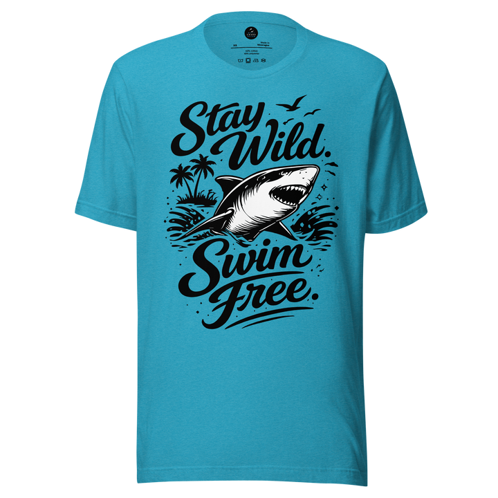 Blue t-shirt with a shark graphic and text 'Stay Wild Swim Free' on a white background