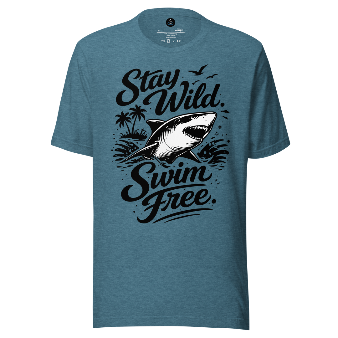 Blue t-shirt with shark graphic and text 'Stay Wild Swim Free' on a white background