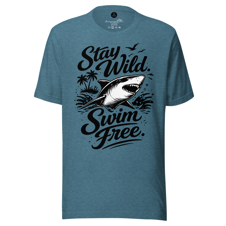 Blue t-shirt with shark graphic and text 'Stay Wild Swim Free' on a white background