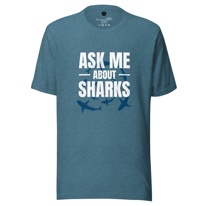 Blue t-shirt with 'Ask Me About Sharks' text and shark graphics on a white background