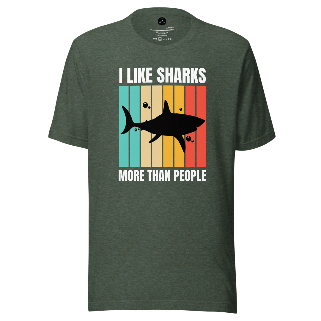Green t-shirt with shark graphic and text on a white background