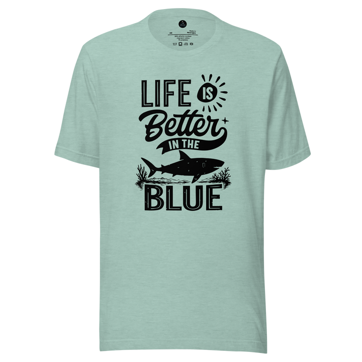 Light blue t-shirt with 'Life is Better in the Blue' text and shark graphic on a white background