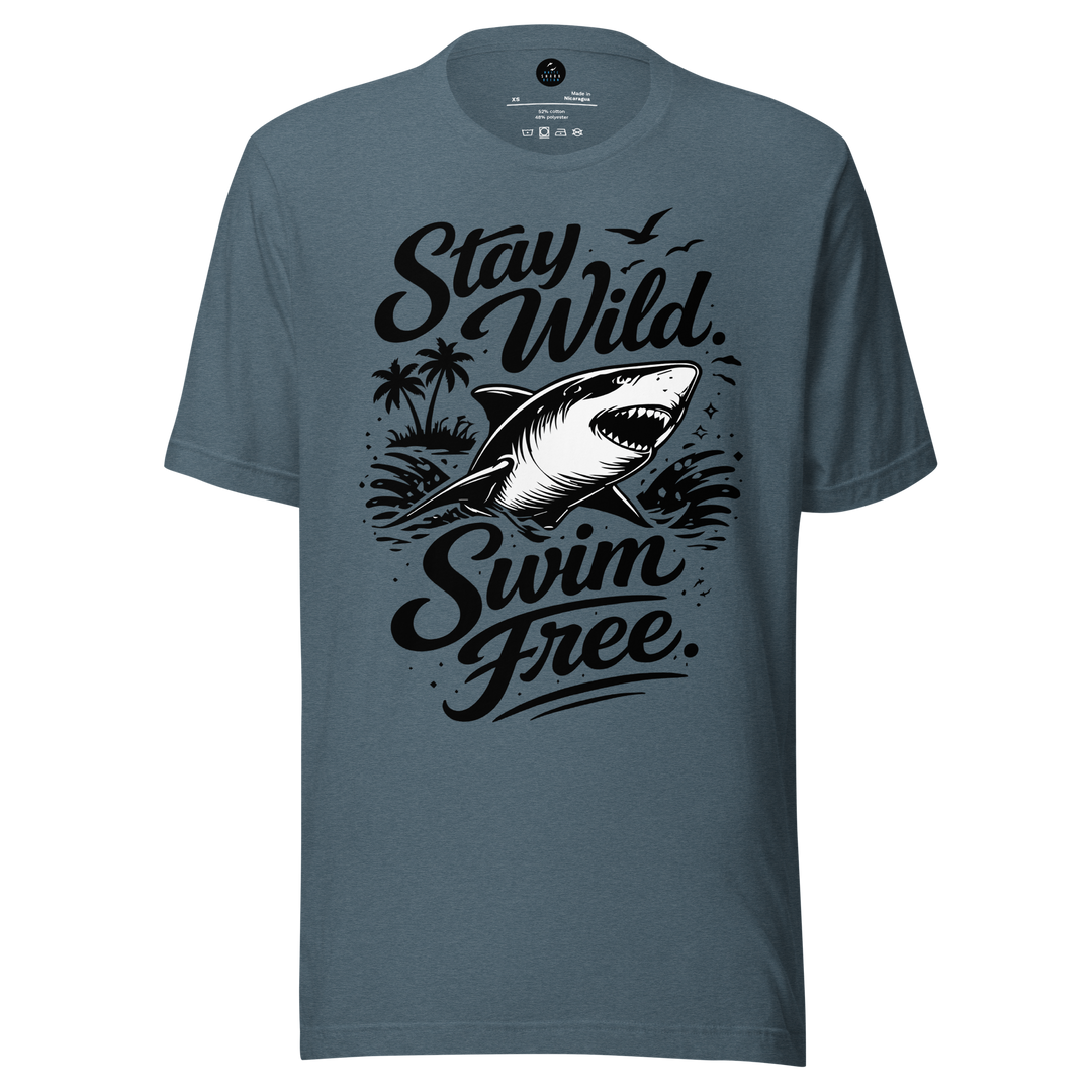 Blue t-shirt with shark graphic and text 'Stay Wild Swim Free' on a white background