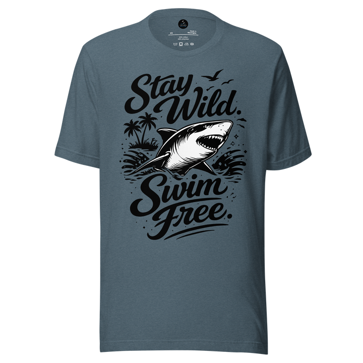Blue t-shirt with shark graphic and text 'Stay Wild Swim Free' on a white background