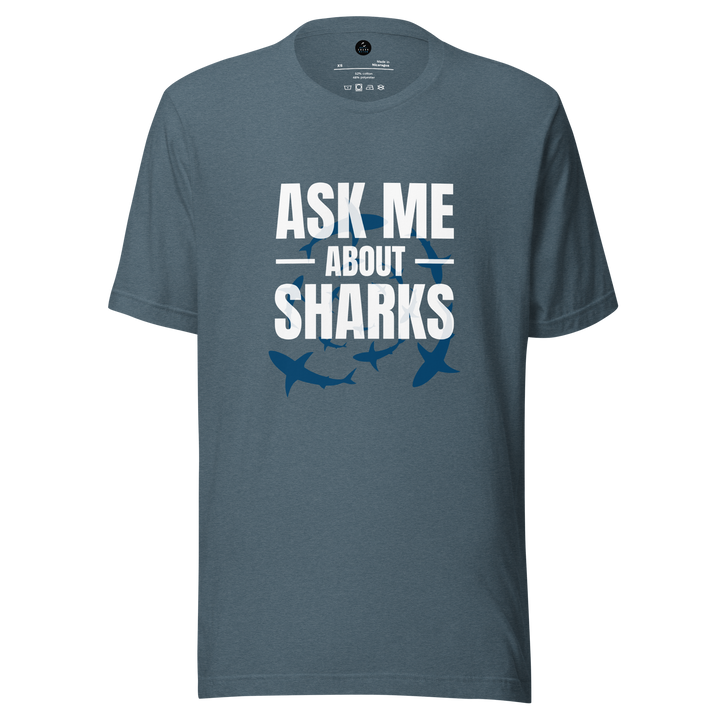 Blue t-shirt with 'Ask Me About Sharks' text and shark illustrations on a white background