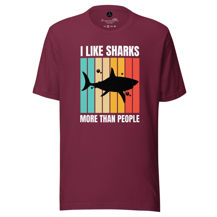 Maroon t-shirt with shark graphic and text on a white background