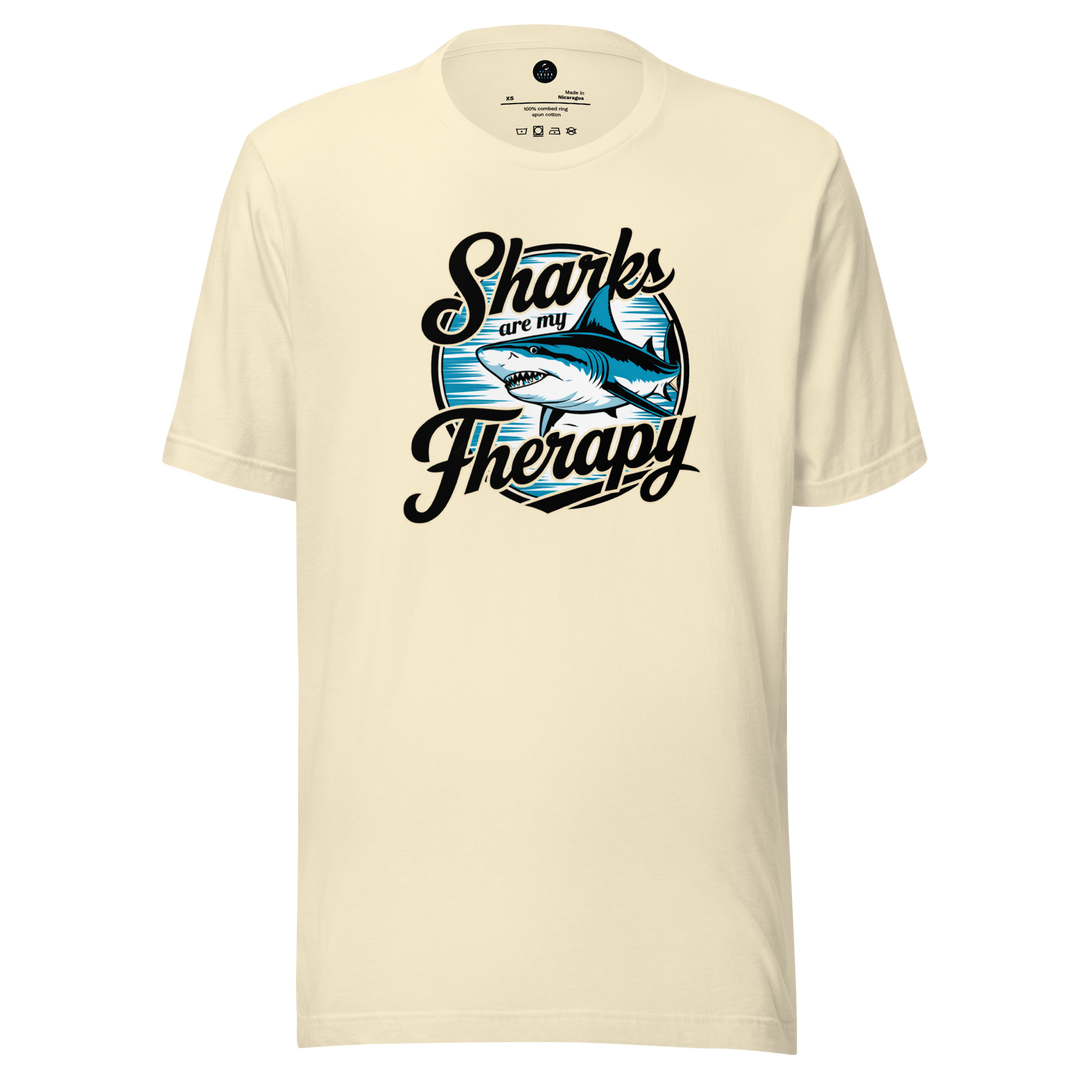 Beige t-shirt with 'Sharks are my Therapy' graphic design on a white background