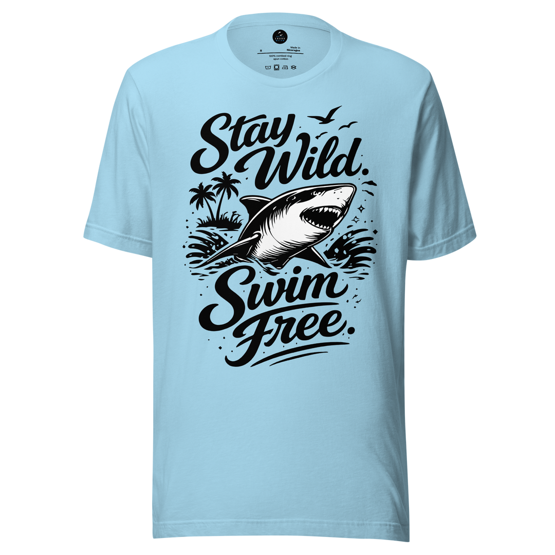 Light blue t-shirt with black shark graphic and text 'Stay Wild Swim Free' on a white background
