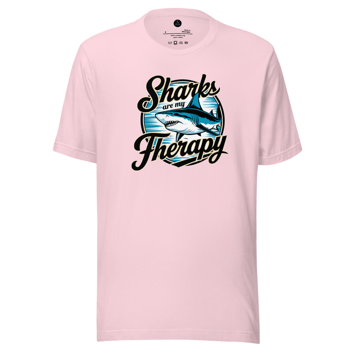 Pink t-shirt with a shark graphic and text on a white background