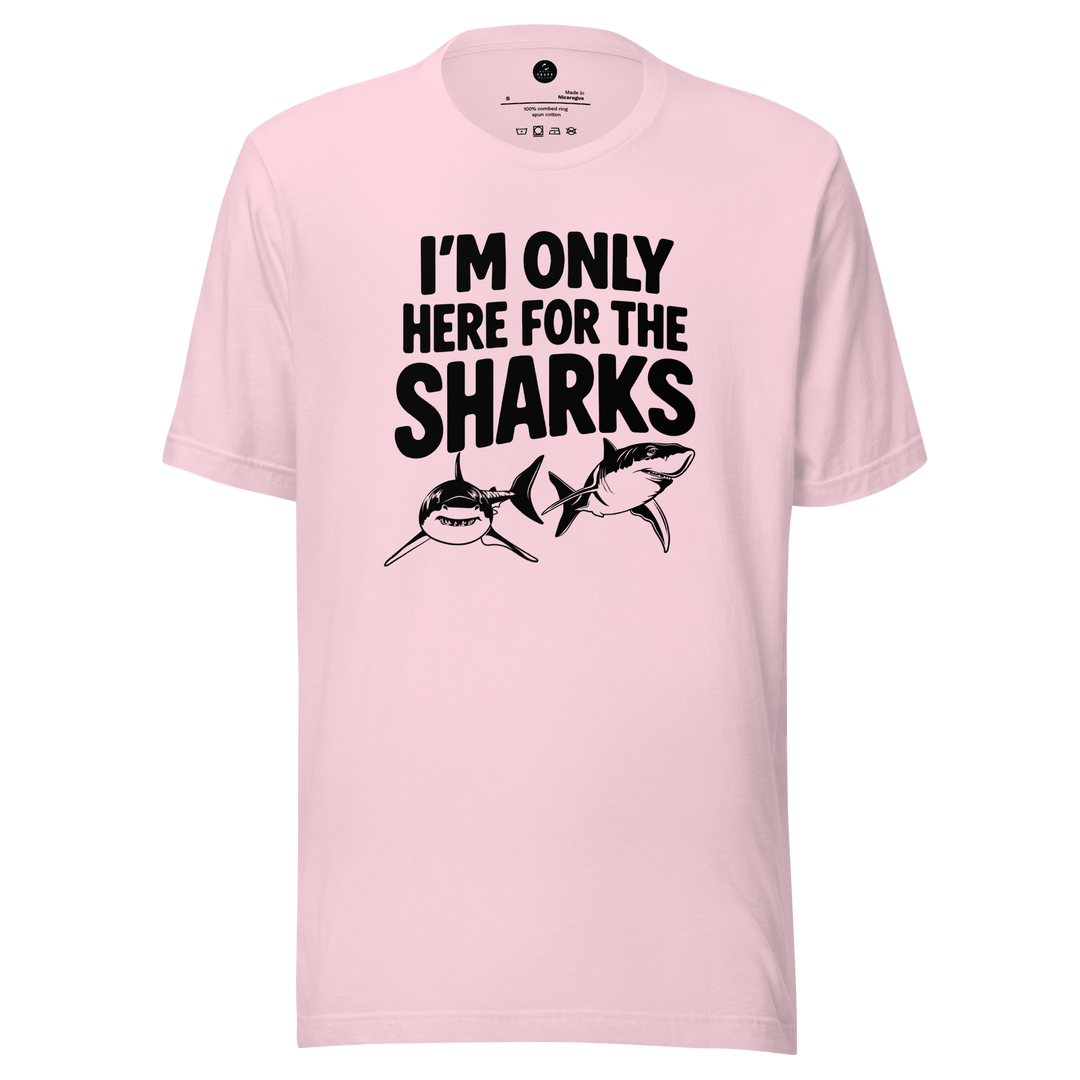 Pink t-shirt with black text and shark graphics on a white background