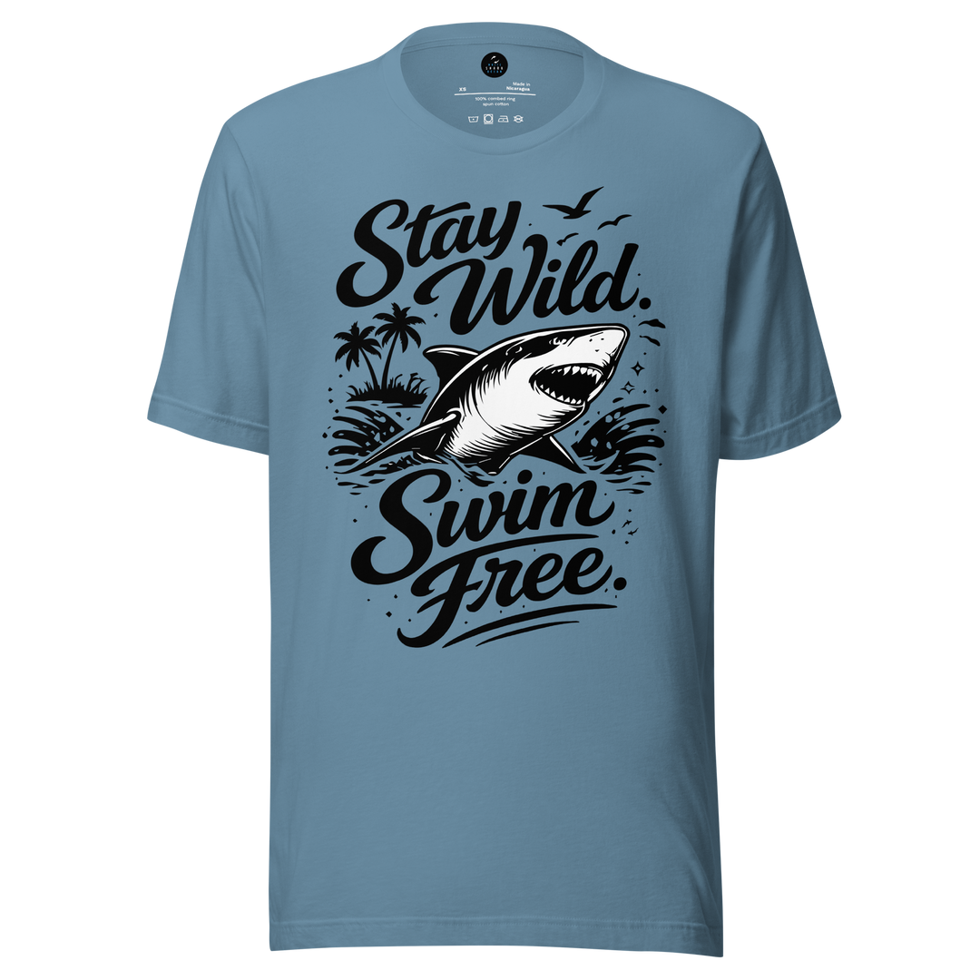 Blue t-shirt with a shark graphic and text 'Stay Wild Swim Free' on a white background