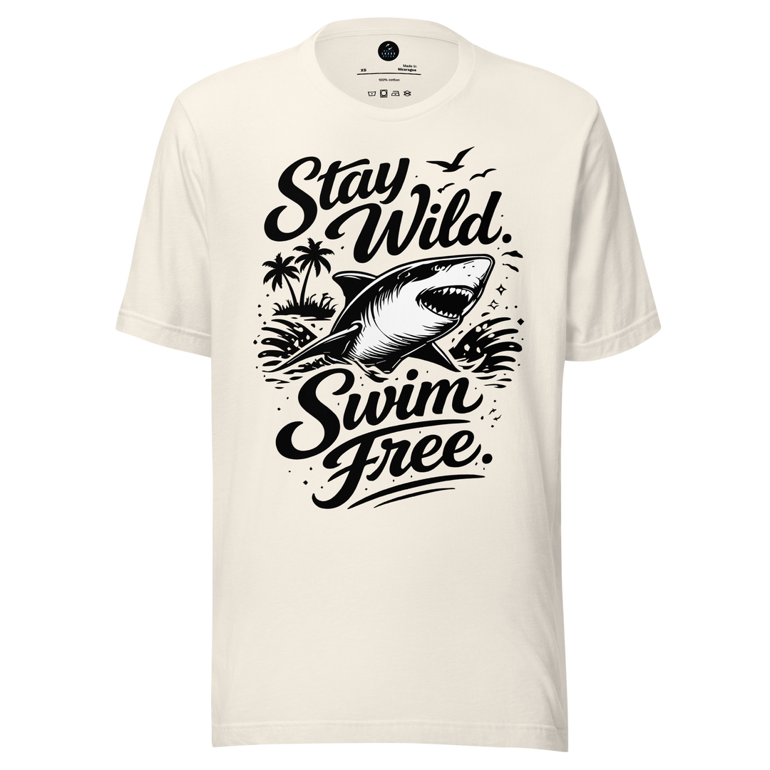 White t-shirt with black shark graphic and 'Stay Wild Swim Free' text on a white background