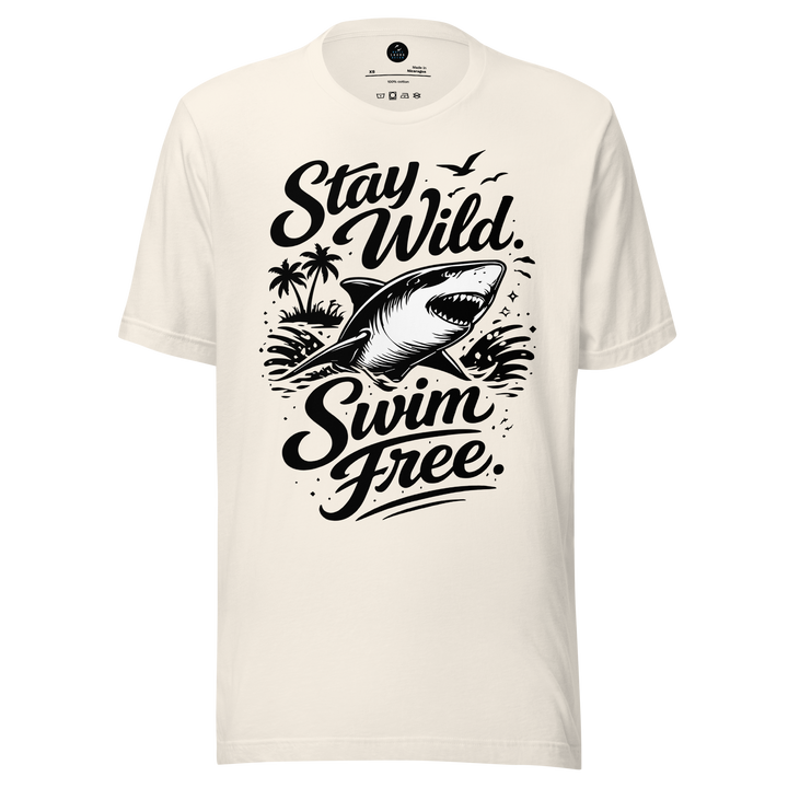 White t-shirt with black shark graphic and 'Stay Wild Swim Free' text on a white background